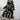 Plus size abstract print midi dress with long sleeves and tie waist, modeled by fashion model with long hair, suitable for party attire or formal events.