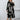 Plus size abstract print midi dress with long sleeves, tie waist, and suitable for party attire, showing shoulder, neck, waist, knee, and thigh areas.