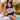 Plus size dark blue crochet halter bikini set with a high-waisted bottom, worn by a person with sunglasses in a sunny outdoor setting.