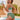 Plus size model wearing a black crochet halter bikini set with a high-waisted design, standing outdoors. She is smiling and wearing sunglasses, with a backdrop of a clear blue sky and water, surrounded by some greenery.