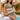 Plus size black crochet halter bikini set with a high-waisted design, worn by a model showcasing the swimsuit top.