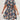 Plus size knee-length summer dress with blue floral tropical print, featuring short sleeves and a round neckline, worn by a model.