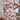 Plus size knee-length summer dress in a blue floral tropical print with short sleeves, modeled by a woman with brown hair.