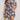 Plus Size Blue Floral Tropical Print Knee Length Summer Dress in Royal Blue, worn by a woman, displaying vibrant floral patterns and featuring a relaxed fit suitable for summer.