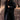 Stylish women's plush black faux fur winter coat in XL, featuring long sleeves and a waist-length design, worn by a standing model.