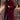A stylish women's plush beige faux fur winter coat in an XL size, featuring a luxurious overcoat design with a focus on outerwear elements such as prominent shoulders and sleeves. The image includes variations in color with a red hue, showcasing the texture and appeal of the textile material. The coat is modeled with accessories like sunglasses, adding to the fashionable and winter-ready look.