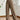 Women's plush teddy bear sweatpants in a cozy fleece material, designed for winter lounging. The image shows the sweatpants focusing on the waist and thigh areas, emphasizing comfort and warmth in a soft white color.