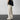 White XXL retro streetwear trousers featuring a unique Polaroid pattern print, displaying various shades of grey and beige with a focus on textile details, waist, knee, and joint areas.