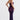Purple floral lace backless corset evening gown with floor-length design, featuring elegant detailing around the shoulder and waist, worn by a model with black hair.