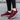 Red women's lightweight breathable running sneakers designed for sportswear, featuring a sleek and stylish design suitable for walking or running.