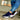 A pair of blue women's breathable mesh slip-on sneakers in size 43, showcased on a model wearing denim. The sneakers feature a lightweight design perfect for fashion and sportswear.