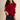 Red cable knit sweater featuring a luxurious textured design with long sleeves and a round neckline, showcasing the garment's cozy and stylish appearance.