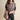 Luxurious beige avocado XXL cable knit sweater featuring a textured pullover design with detailed shoulder, neck, and sleeve accents displayed on a fashion model.
