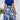 A red floral high-waisted A-line skirt displayed on a mannequin, showcasing its elegant design with vibrant floral patterns against a white background, perfect for women's fashion.