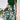 Red floral A-line skirt with a high waist, featuring vibrant floral patterns, styled as part of a fashionable day dress ensemble.