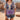 A vibrant red floral bohemian blouse with lightweight short sleeves, featuring purple and white floral patterns, available in XL size. The blouse has a flowy design with a relaxed fit, a round neck, and a comfortable waistline.