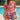 Red floral bohemian blouse with short sleeves, designed for summer, shown on a person wearing size XL.