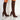 Red knee-high sock boots with high heels in ribbed fabric, styled for fashion, shown in a standing position on a human leg.