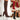 Red knee-high sock boots with high heels, featuring a ribbed fabric design, shown on a model's legs.