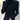A person wearing a black ribbed turtleneck sweater paired with gold pearl hoop earrings, styled for a chic winter look.