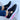 Red slip-on platform sneakers with breathable cut-out design and chain detail, shown in Nero color variant, size 42, worn on a human leg.