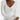 Ribbed V-neck cream maxi sweater dress with long sleeves, featuring a fitted waist and elegant fall fashion design.