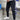 Men wearing black tapered track pants in a slim fit design, showcasing a moisture-wicking fabric, standing with visible emphasis on the waist and legs.