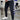 Men's black tapered track pants shown in a slim fit design, highlighting the moisture-wicking fabric. The focus is on the lower body, with emphasis on the waist, thigh, and leg areas.