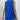 Woman wearing a royal blue sleeveless flowy summer top with back button closure, smiling and showing part of her arm and neck.