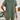 Rust red ribbed knit top with short sleeves displayed on a mannequin, showcasing its casual summer style and shoulder detailing.