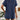 Rust red ribbed knit top displayed on a mannequin, showcasing short sleeves and a round neckline.