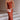 Rust satin midi slip dress with a backless tie-back design, featuring an elegant silhouette. The dress showcases a smooth satin texture, highlighting the waist and shoulder areas. It also displays a sleeveless cut with a focus on the neckline and overall elegant fit.