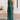 Rust satin midi slip dress featuring a backless design with tie-back detail, elegant and sophisticated. Model with long hair, smiling, showcasing the dress with exposed shoulders and arms.