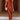 Rust satin midi slip dress in a backless design with tie-back detailing, shown in a brown color and XL size, featuring a sheath silhouette that highlights the shoulders and waist, suitable for elegant wear.