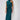 Elegant backless formal dress in blue petroleum color, featuring a halter neck and a satin fabric with a flowing knee-length design.