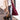 Sherpa-lined parka coat featuring a layered winter fashion design, showcasing a white dress shirt, tartan pattern, and sleeve detailing, worn by a person standing and accessorized with a bag.