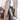 Gray Sherpa-lined parka coat in size 3XL, featuring a layered design ideal for winter; the coat is styled with a white dress shirt and jeans.