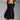 A woman wearing a sleeveless black mini dress with a 3D floral design, suitable for a summer party, in size XL.