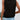 Sleeveless backless black top worn by a woman paired with jeans, highlighting the casual summer fashion style.