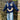 Oversized navy blue knit sweater with a smiley face emoji design, featuring a round neck and long sleeves, suitable for women's trendy fashion.