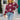 Blue and white star pattern crewneck sweater worn by a person standing, paired with jeans, showcasing the sweater's casual knitwear design with long sleeves.