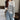 Women's loose fit black and white striped crewneck sweater pullover, showcasing a casual and comfortable style with long sleeves and a relaxed hemline.