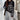 Women's black and white striped crewneck sweater showcasing a loose fit pullover design, with visible shoulder and sleeve details, emphasizing its fashionable outerwear appeal.