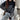 Striped black and white women's crewneck sweater with a loose fit and long sleeves, styled as a casual pullover.