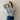 Women's black and white striped crewneck sweater with loose fit, featuring long sleeves and a comfortable pullover design.