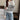 Striped crewneck sweater in black and white, designed for women with a loose fit pullover style, featuring long sleeves and contrasting horizontal stripes.