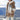 Striped fleece women's hooded Sherpa jacket in warm colorblock design, featuring plush material and a cozy hood, perfect for cold weather.