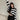 Striped oversized black and white knit sweater worn by a person, highlighting the trendy autumn fashion design with long sleeves and relaxed fit.