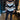 A person wearing a striped sweater, black leggings, and white ankle boots, posing in a chic autumn outfit.