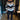 Woman wearing a striped sweater paired with black leggings and white ankle boots, styled for a chic autumn look.